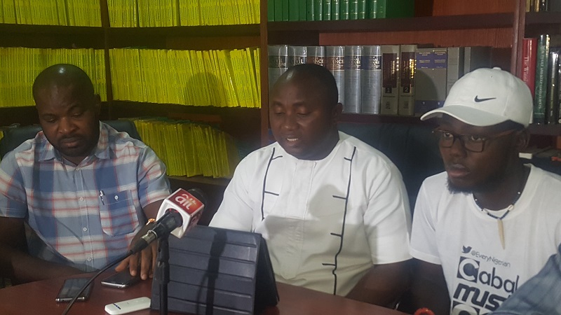 Dare Ariyo Atoye (middle) addressing a press conference in Abuja on Tuesday