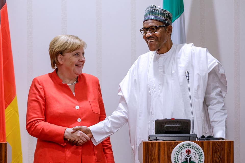 President Buhari in a handshake with German Chancellor Merkel 