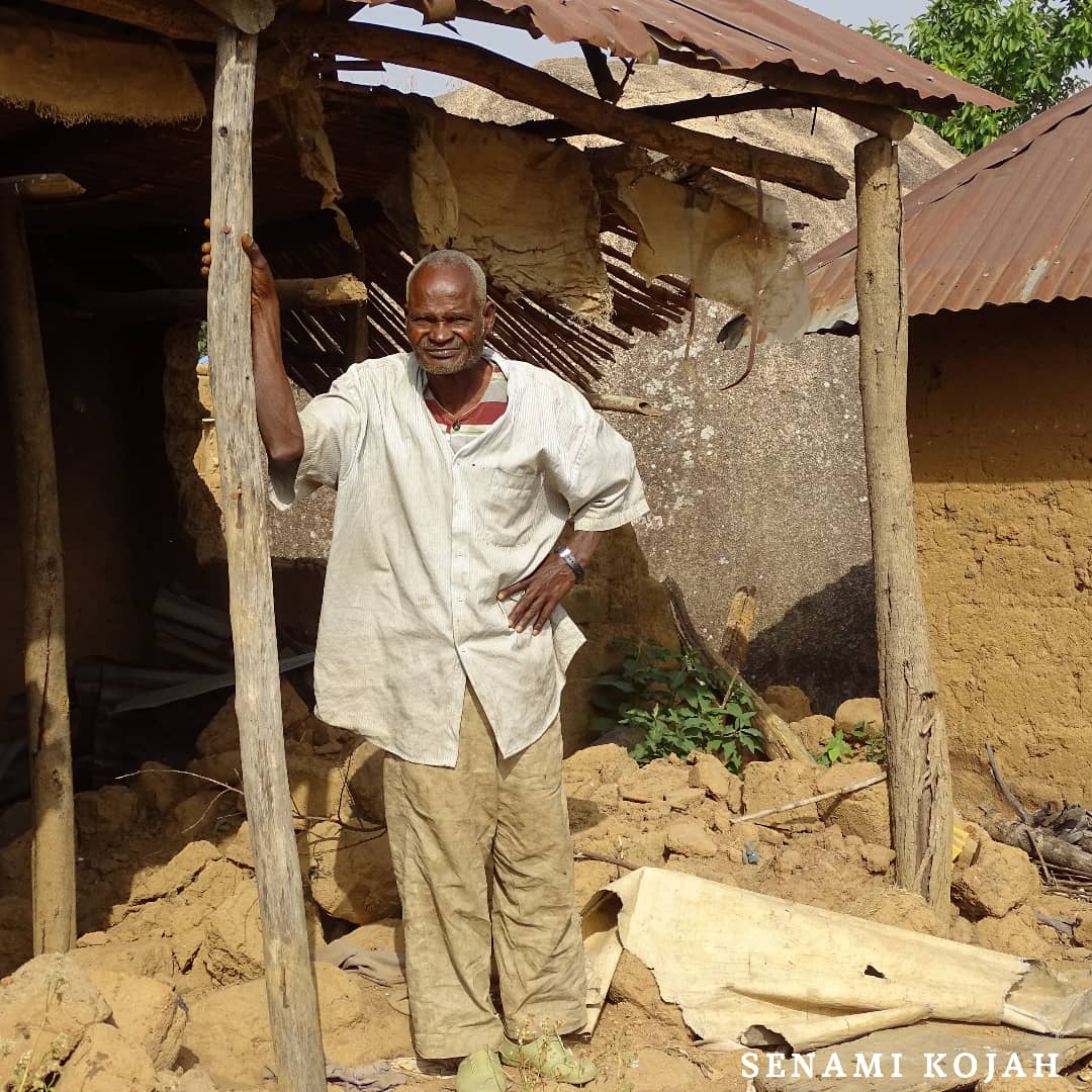 Samaila Mahan, 76, sleeps on the bare floor in his damaged hut.