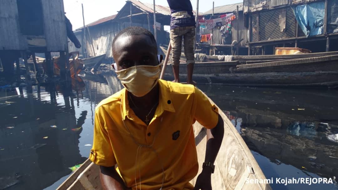 Moses Stephen (Bobo) is a fisherman turn tour guide in Makoko.