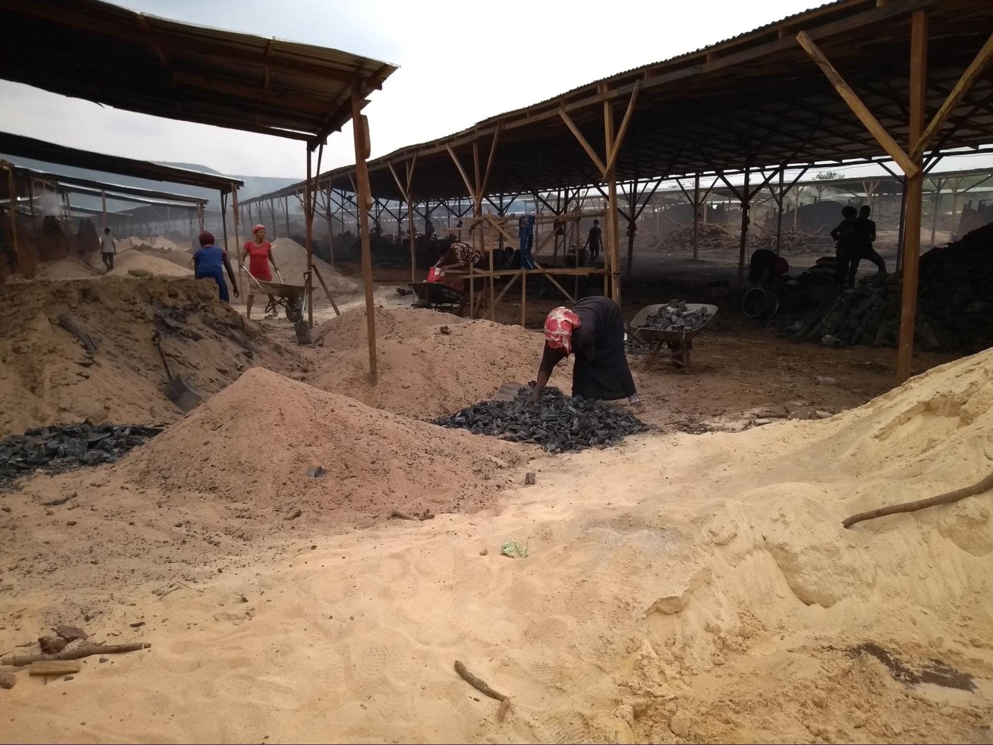  Workers at the Chinese-run charcoal factory in Obimo 