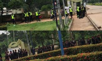 BREAKING: Armed Policemen Take Over Ambrose Alli University Gate To Intimidate Students Protesting Against Tuition Fees Hike