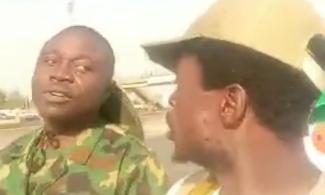 VIDEO: Nigerian Army Personnel Assault, Arrest Corps Member Who Trekked For 24 Days From Ondo To Abuja To See Tinubu