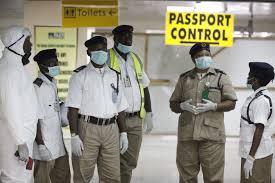 Nigeria health officials wait to screen passengers at the arrival hall of Murtala Muhammed International Airport in Lagos