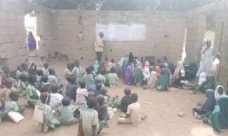 Pupils In Bauchi School Learn While Sitting On Bare Floor, Inside Building Without Roof, Windows