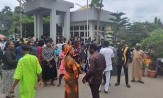 Nigerian Workers Protest At Ministry Of Works After Umahi Locked Them Out For Lateness