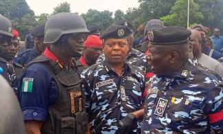 BREAKING: Tension As Police Vans Lead Pro-Tinubu Counter-Protesters To Abuja Stadium