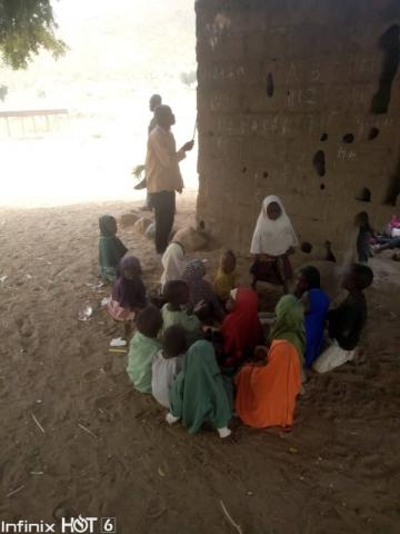 Pupils In Bauchi School Learn While Sitting On Bare Floor, Inside Building Without Roof, Windows